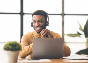 A sales development representative (SDR) talking on a headset