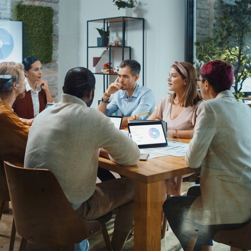 Diverse Team of Professional Businesspeople have Meeting in the Modern Office Conference Room. Ambitious, Creative Start-up Entrepreneurs Discuss Analysis Data, App Design, Product Concept.